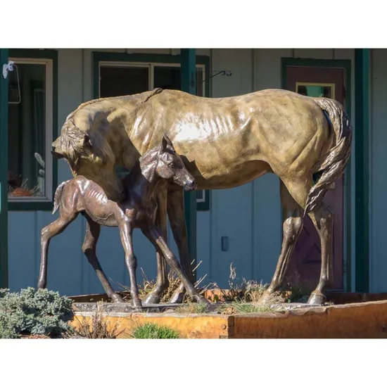 Large Bear Bronze Statue Climbing on The Branch in The Park 